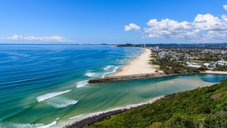 Burleigh Head National Park walking trail overlooking the ocean under clear blue winter skies — a tranquil moment capturing the peaceful charm of the Gold Coast in winter.